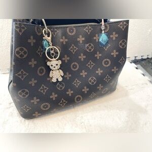 Golden Teddy Bear charm for luxury designer handbags.